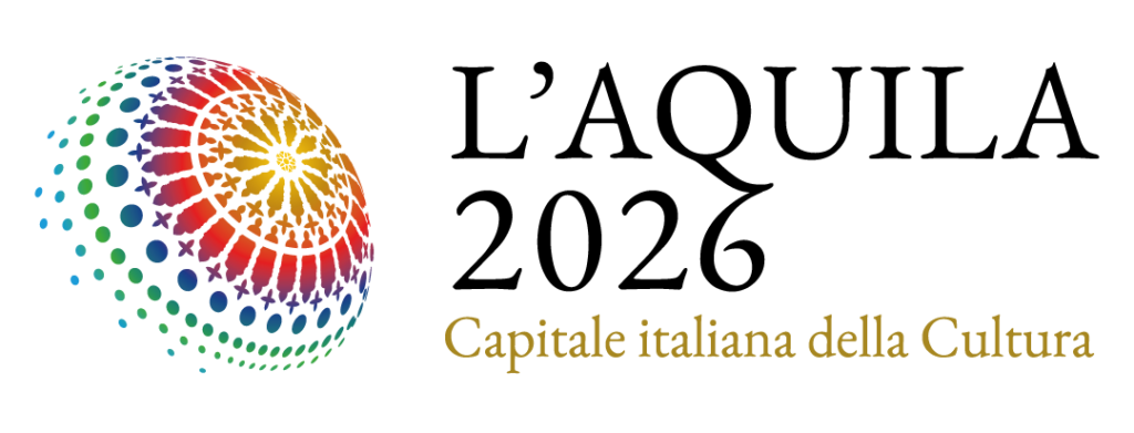 Historic Abruzzo village nestled in scenic mountains with traditional houses and lush surroundings.