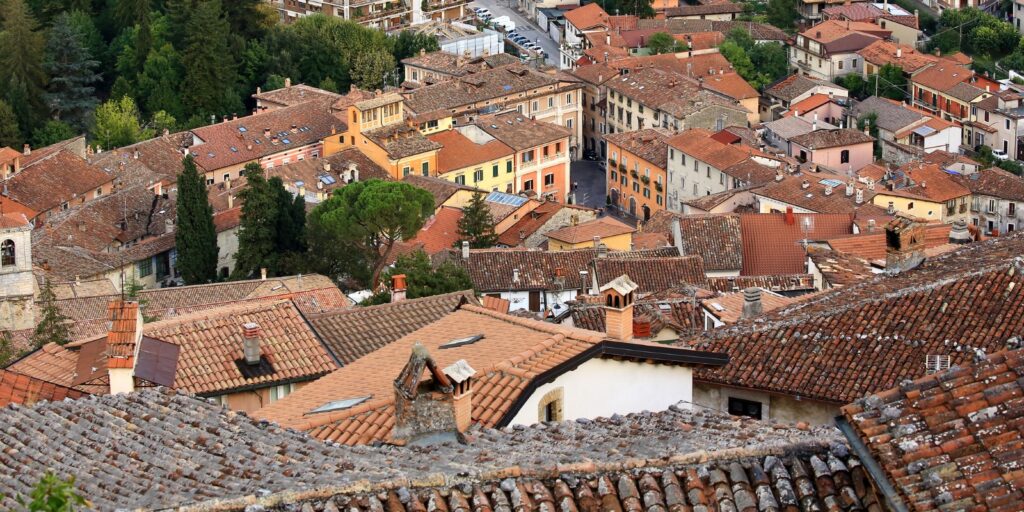 looking down on the Piazza dell'Obelisco and it's wealthy palazzo style living from the cramped high town