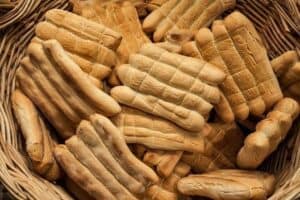 Traditional Italian breadsticks in a basket, representing Abruzzo's culinary heritage.