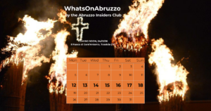 Night scene of burning torches with flames and smoke at the Sant'Antonio Fire Festival in Abruzzo.